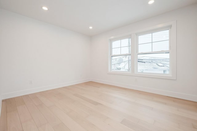 unfurnished room featuring light hardwood / wood-style floors