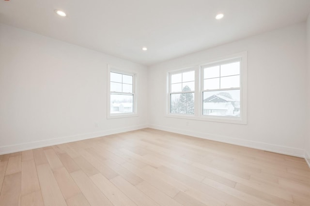 unfurnished room featuring light hardwood / wood-style floors