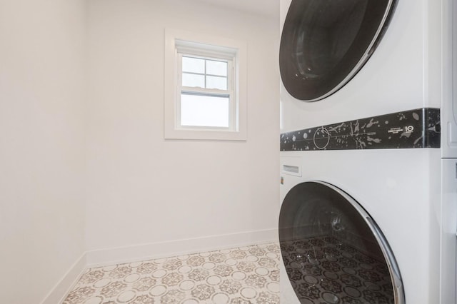 washroom featuring stacked washing maching and dryer