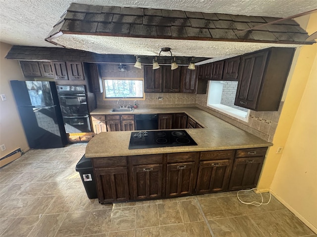 kitchen featuring decorative backsplash, sink, black appliances, and dark brown cabinets