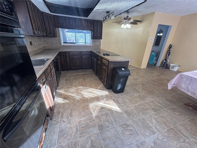 kitchen featuring ceiling fan, range hood, kitchen peninsula, black electric cooktop, and decorative backsplash