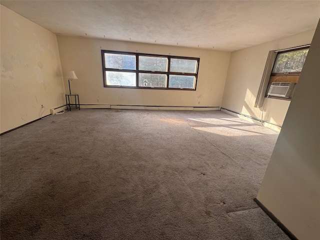 carpeted spare room featuring cooling unit and a healthy amount of sunlight