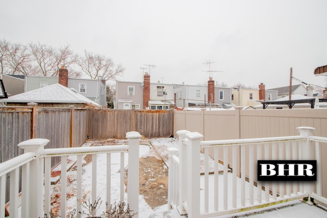 view of yard layered in snow