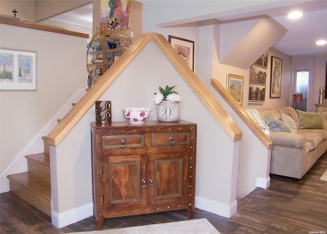 stairs featuring hardwood / wood-style flooring