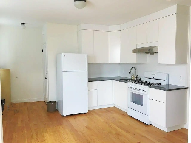 kitchen featuring light wood-type flooring, white appliances, white cabinetry, and sink