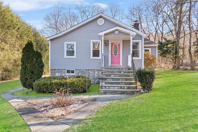 bungalow-style house with a front lawn