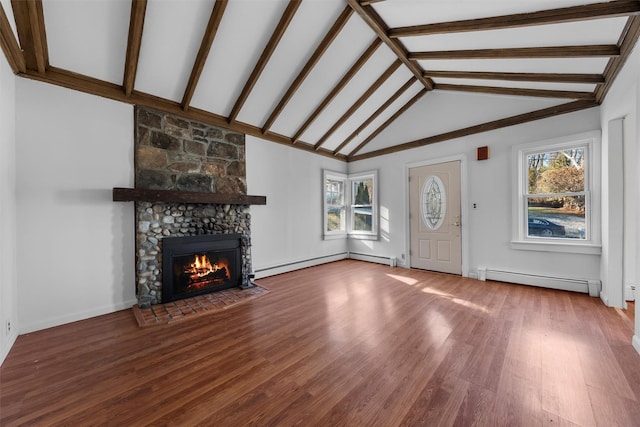 unfurnished living room with baseboard heating, a stone fireplace, hardwood / wood-style floors, and lofted ceiling with beams