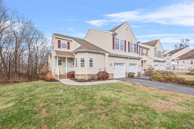 view of front of house featuring a front yard and a garage