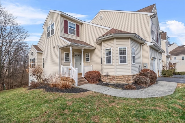 view of front property with a front yard and a garage