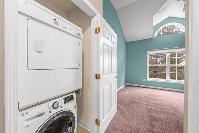 clothes washing area featuring light colored carpet and stacked washer / dryer