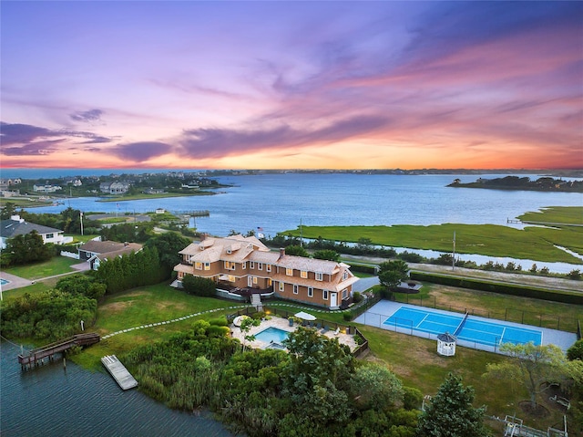 aerial view at dusk with a water view