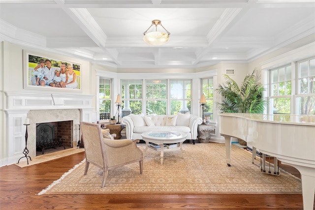 sunroom / solarium featuring a fireplace, beamed ceiling, and coffered ceiling