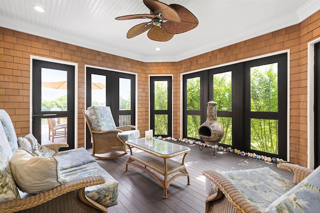 sunroom with french doors and ceiling fan