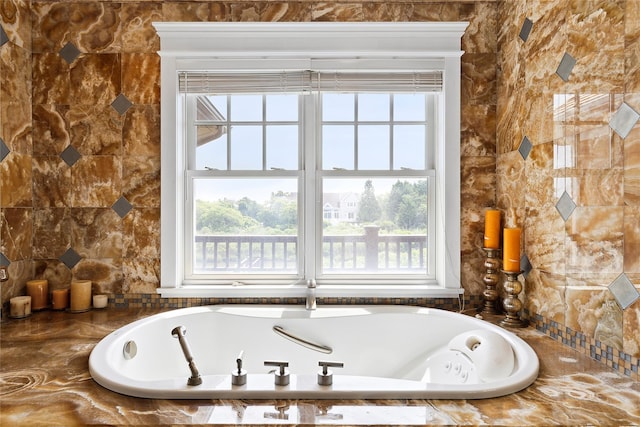 bathroom with tiled tub