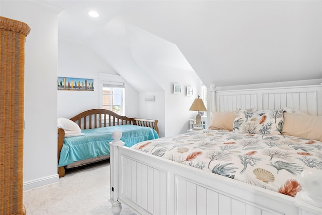 bedroom featuring light carpet, crown molding, and lofted ceiling