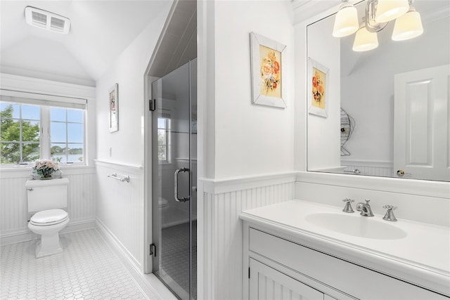 bathroom with tile patterned floors, an enclosed shower, vaulted ceiling, toilet, and vanity