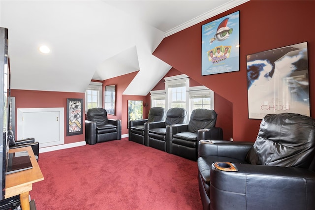 carpeted cinema with crown molding and lofted ceiling