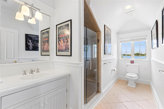 bathroom featuring a shower with door, vaulted ceiling, tile patterned flooring, toilet, and a notable chandelier