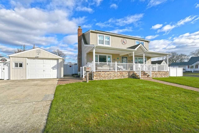 view of front of house with covered porch, a garage, an outdoor structure, and a front lawn