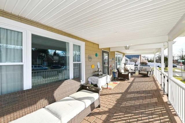 view of patio featuring a porch and grilling area