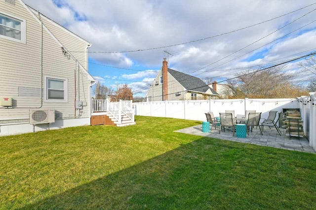 view of yard featuring ac unit and a patio area