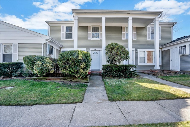 view of front facade with a front yard