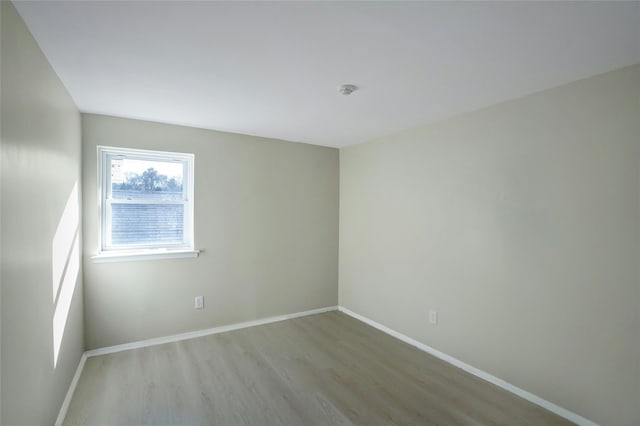 unfurnished room featuring light hardwood / wood-style flooring