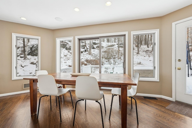 dining room with dark wood-style floors, recessed lighting, and baseboards