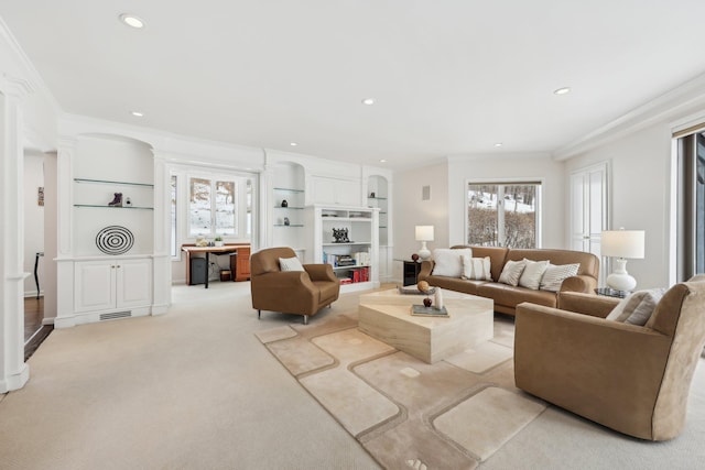 living area featuring ornamental molding, a wealth of natural light, and recessed lighting