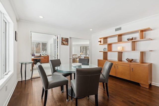 dining area with recessed lighting, dark wood-style flooring, visible vents, and crown molding