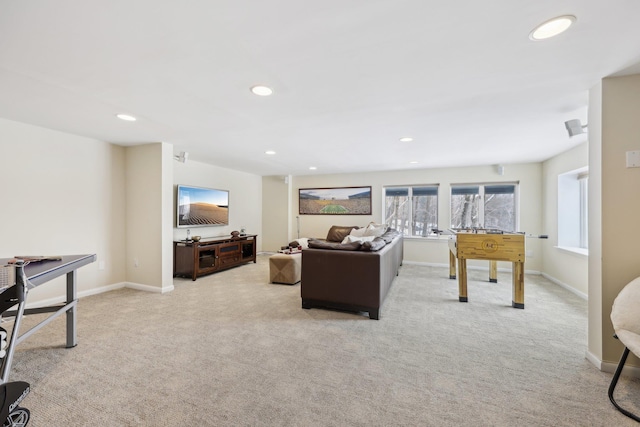 living room featuring baseboards, recessed lighting, and light colored carpet