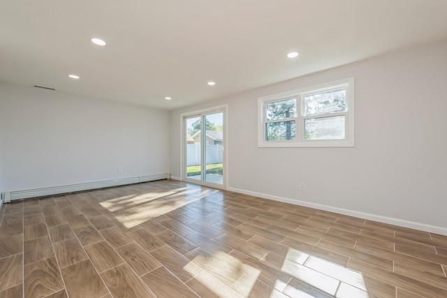 spare room with a baseboard radiator