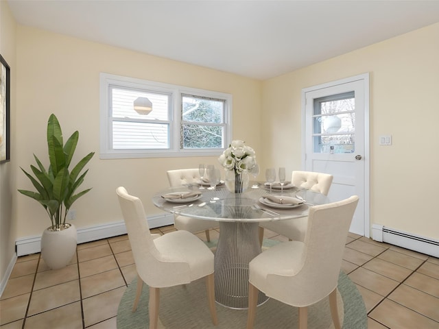 dining area featuring light tile patterned floors and a baseboard radiator