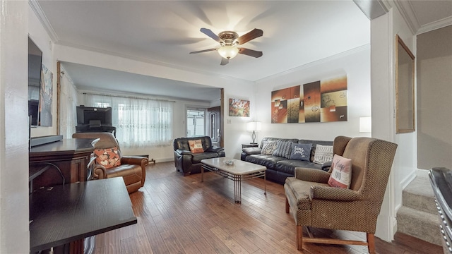 living room with hardwood / wood-style floors, ceiling fan, and ornamental molding