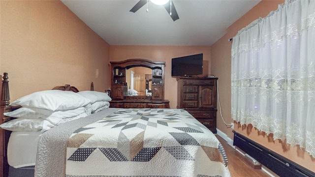 bedroom featuring ceiling fan and wood-type flooring