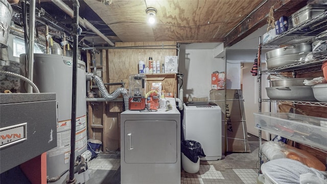 laundry area featuring independent washer and dryer and water heater