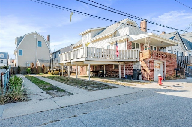 view of front of property with a wooden deck