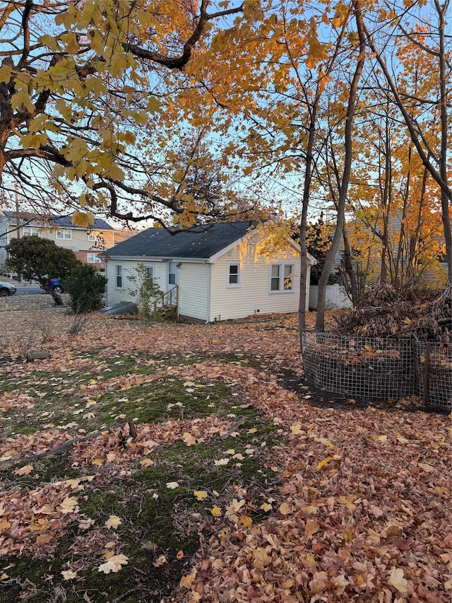 view of side of home with fence