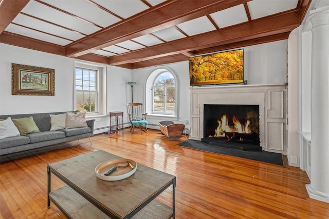 living room featuring hardwood / wood-style flooring and beamed ceiling