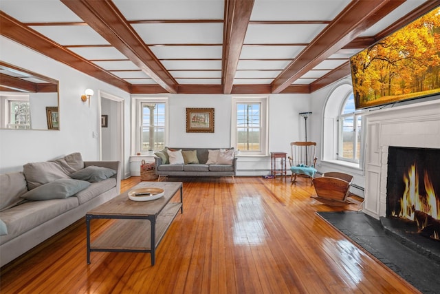 living room with wood-type flooring, beamed ceiling, and a baseboard radiator