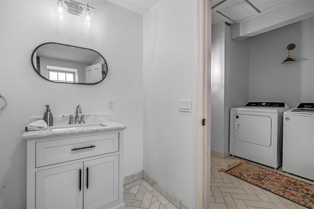 bathroom with washer and dryer and vanity