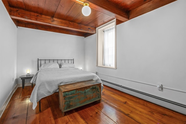 bedroom with wooden ceiling, baseboard heating, wood-type flooring, and beamed ceiling