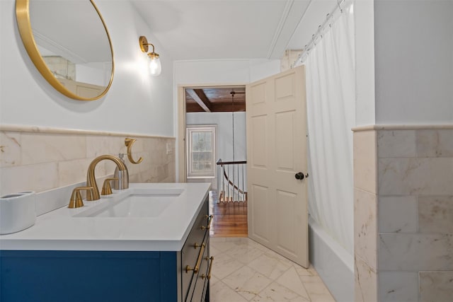 bathroom with wooden ceiling, tile walls, shower / bath combo, and vanity