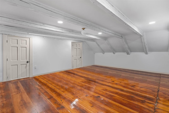 bonus room featuring hardwood / wood-style flooring and lofted ceiling with beams