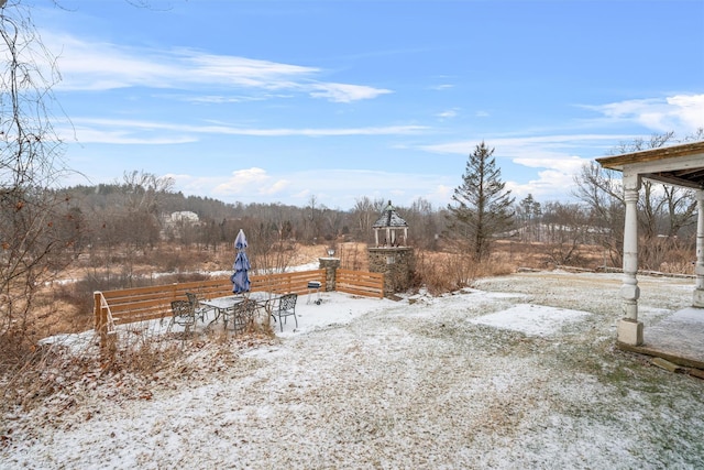 view of yard layered in snow