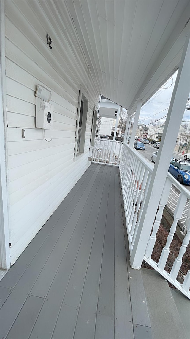 wooden terrace with a porch