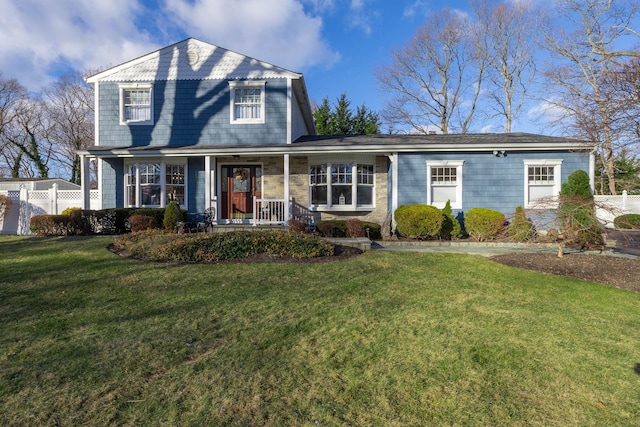 view of property featuring a front lawn