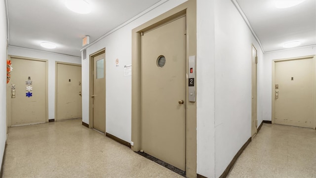 hall featuring ornamental molding