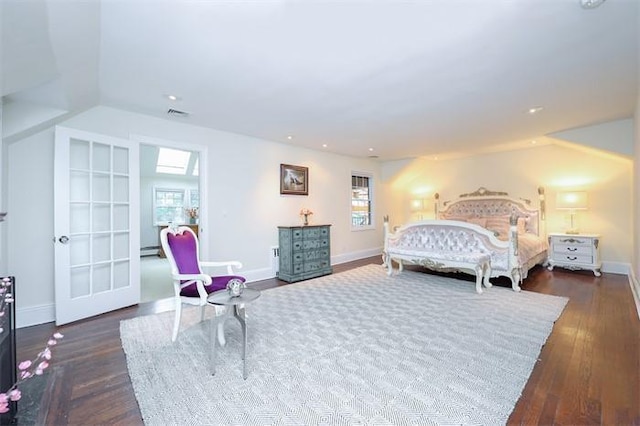 bedroom featuring dark hardwood / wood-style flooring and vaulted ceiling