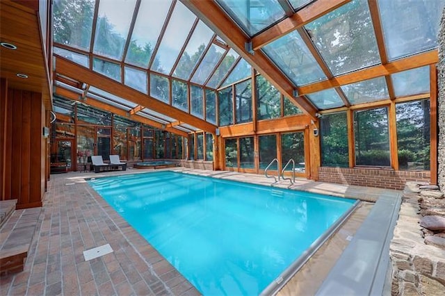 view of swimming pool featuring a patio area and an indoor in ground hot tub